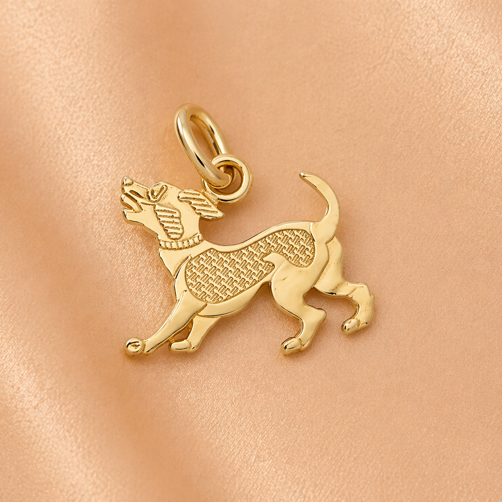 Gold dog-shaped pendant on a pink leather background
